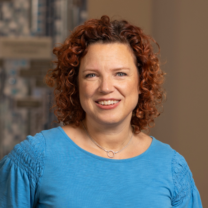 Headshot of a women in a blue top | Kimberlee Blyden-Taylor