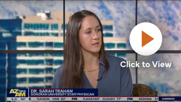 Dr. Sarah Trahan, a staff physician at Sonoran University, appears on a morning television segment with the AZ Fox10 AM logo visible at the bottom left. She is seated indoors, with a blurred urban backdrop behind her.